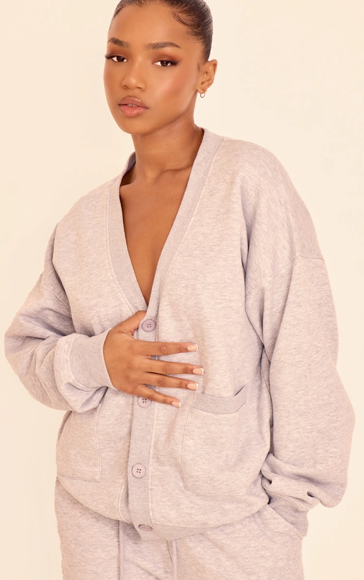 Sweat cardigan sweat gris chiné à poches et boutons