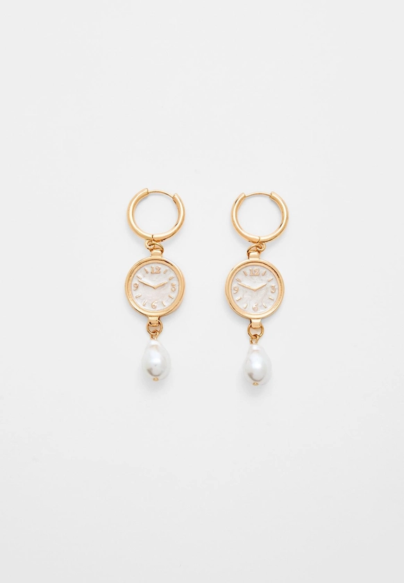 Watch and faux pearl earrings