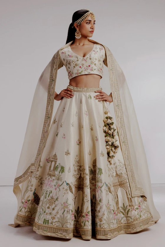 Buy Ivory Pure Raw Silk Hand Embroidery Mughal Garden Bahaar Applique Lehenga Set For Women by Taisha Online at Aza Fashions.