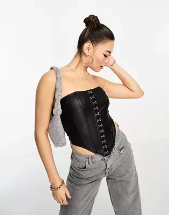 ASOS DESIGN leather look corset bustier with hook and eye detail in black | ASOS