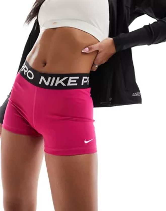 Nike Pro Training Dri-Fit 5 inch shorts in fireberry pink | ASOS
