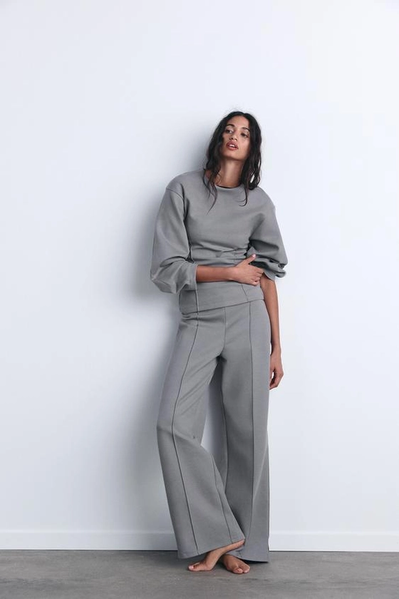 INTERLOCK KNIT TROUSERS WITH VENTS