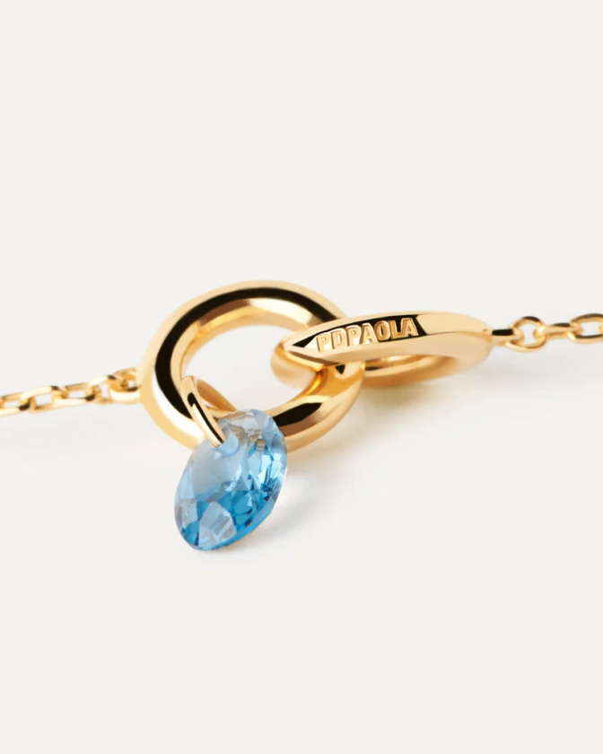 Gold-plated necklace featuring two interlinked rings with a blue zi... | Blue Lily necklace | PDPAOLA