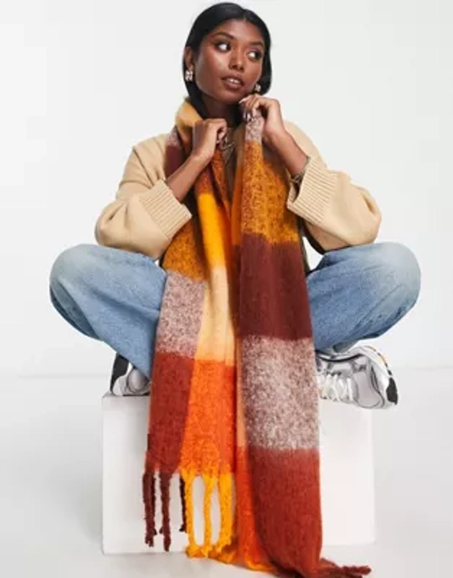 ASOS DESIGN fluffy tassel scarf in orange oversized check