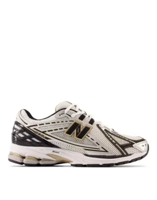 New Balance 1906 trainers in silver and gold