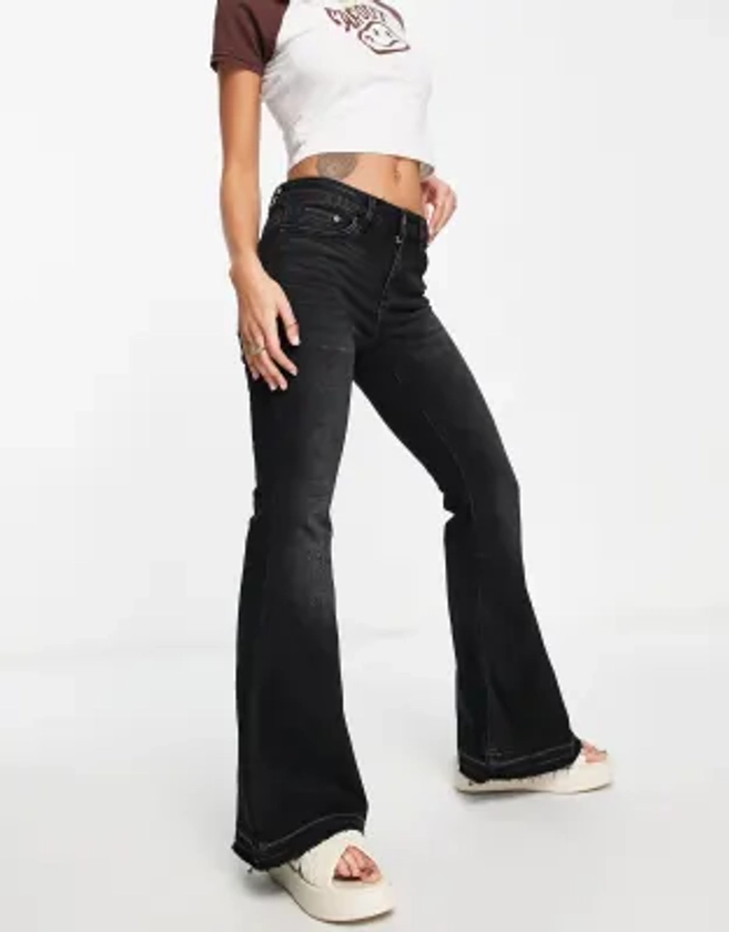 Stradivarius low rise flare jean in black | ASOS