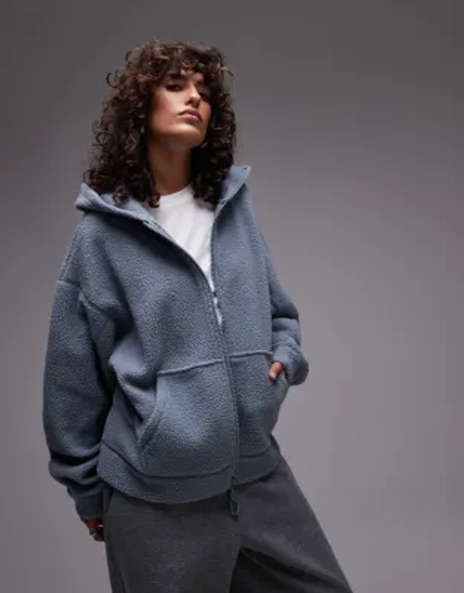 Topshop - Sweat court à capuche zippé en polaire imitation peau de mouton - Bleu pâle | ASOS