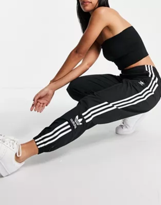 adidas Originals Lock Up three stripe track pants in black | ASOS