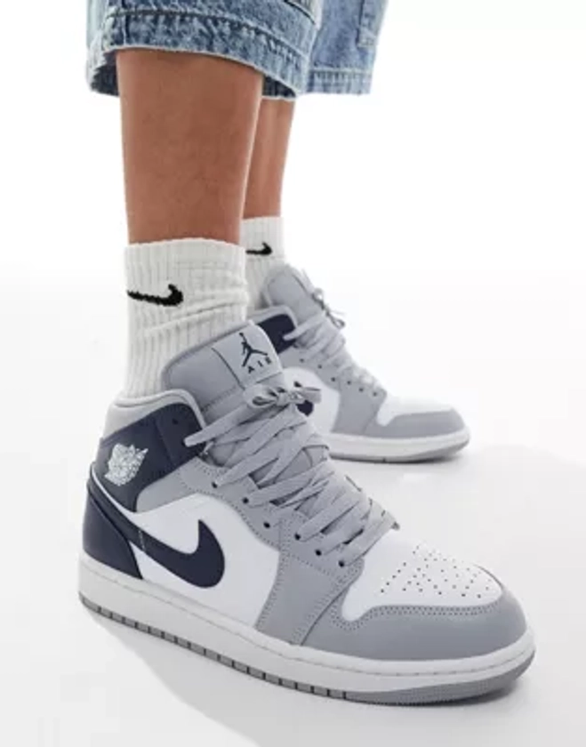 Air Jordan 1 mid trainers in white and navy | ASOS
