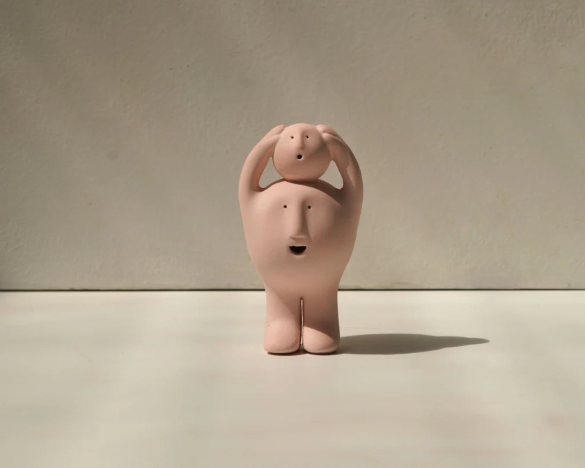 All is Swell - Me and My Conscience, Treehead, and Born Luck Treehead: Unglazed Pink Stoneware Sculpture by Claymen