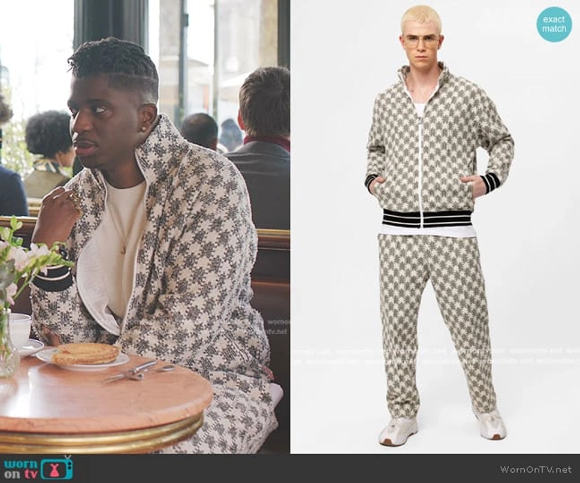 Julien’s white print track jacket and pants on Emily in Paris