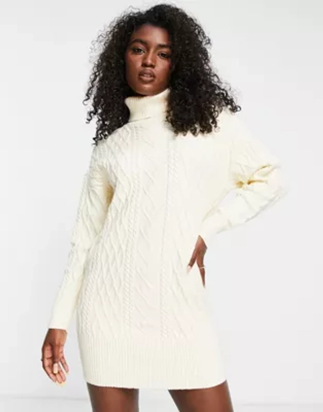 The Frolic - Robe pull courte en maille côtelée avec col roulé - Crème | ASOS