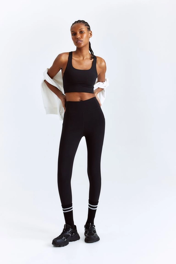 DryMove™ Pocket-detail sports tights - Black - Ladies | H&M GB