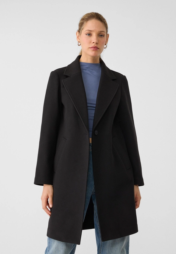 Manteau midi bouton doux au toucher