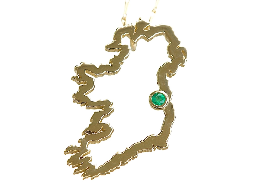 Irish Map pendant set with a round emerald.