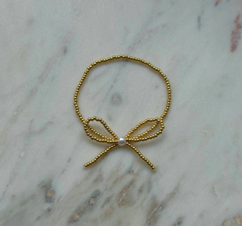 gold beaded bow bracelet