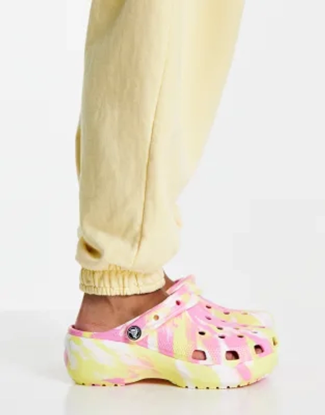 Crocs classic platform clogs in pink and yellow marble | ASOS