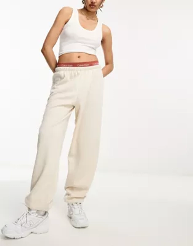 ASOS DESIGN low rise oversized joggers with puddle hem in stone
