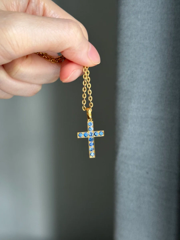 18k cross with natural blue sapphires