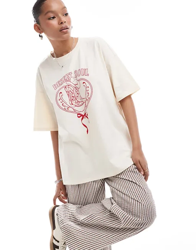 ASOS DESIGN oversized t-shirt with horse shoe cowboy graphic in ecru | ASOS