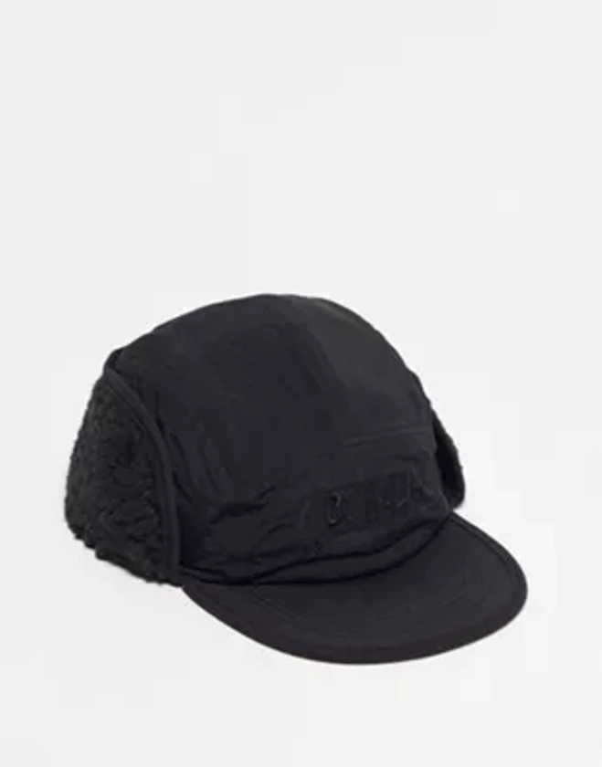 ASOS DESIGN - Casquette à 5 empiècements avec rabat sur les oreilles et doublure en imitation peau de mouton - Noir